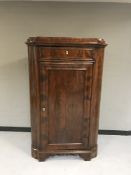 A 19th century mahogany corner cupboard