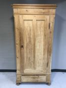 An antique pine hall cupboard
