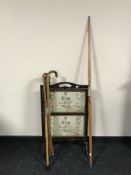 A Jacques of London Archery bow and arrow together with a two walking sticks,