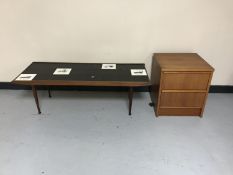 A 1970's teak tiled coffee table depicting vintage cars together with a teak effect three drawer