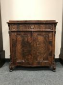 A nineteenth century serpentine fronted mahogany cabinet fitted with a drawer, width 80 cm.