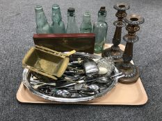 A plated twin handled gallery tray with three pewter tankards, tray of plated cutlery, candlesticks,