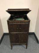 A gramophone in oak cabinet and quantity of 78's