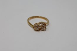An 18ct gold double cluster ring