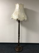A contemporary standard lamp with shade
