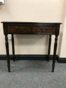 A reproduction mahogany hall table fitted two drawers