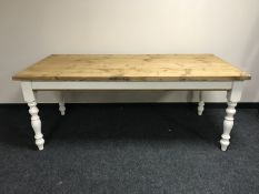 A reclaimed pine farmhouse table on painted legs CONDITION REPORT: This measures