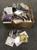 Two boxes of assorted DVDs and CDs