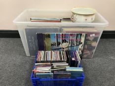 A box of LP records and a crate of CDs