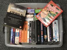 A box containing assorted DVD's and DVD box sets, including Big Bang Theory, Game of Thrones,