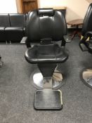 A hydraulic barber's chair