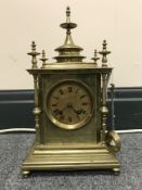 A late 19th century brass carriage clock by R & C of Paris & London with brass finials