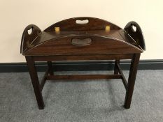 A mahogany butler's tray on stand