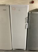 An Indesit upright fridge