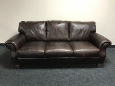 A Itaisofa brown leather three seater settee with matching two seater settee