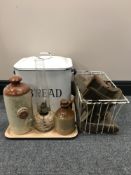 A tray of enamelled bread bin, two stone ware bottles,