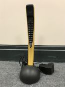 A Bang and Olufsen BeoCom telephone with table charger,