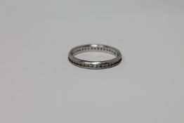 A platinum diamond eternity ring,