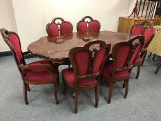 An Italian style pedestal dining table and six chairs