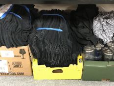 A bin and four boxes of barber's towels, barber's jackets,