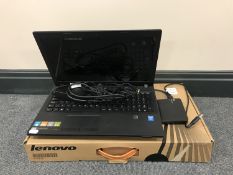 A boxed Lenovo J510 laptop with lead,