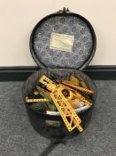 A hat box containing Meccano
