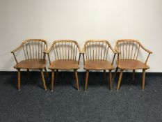 A set of four mid 20th century spindle back armchairs
