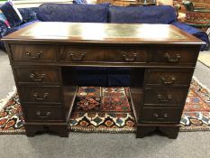 An antique style mahogany pedestal desk,