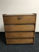 A mid 20th century teak shoe cabinet