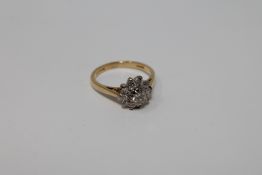 An 18ct gold diamond cluster ring,