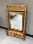 A bamboo framed dressing table mirror fitted with two drawers