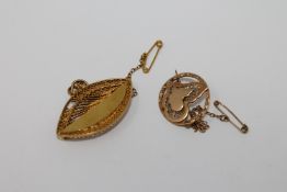 Two yellow metal brooches, 10.