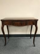 A Victorian mahogany TOT table on cabriole legs