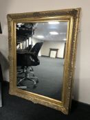 A large gilt framed bevel edged mirror