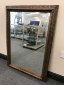 A carved oak framed overmantel mirror