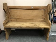 A reclaimed pine pew width 119cm