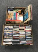 A box containing assorted DVD's and CD's together with a further box containing LP's, Tin Tin books,