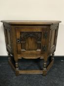 A Priory oak cabinet