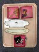 Two boxed Butler and Wilson fashion necklaces with matching earrings,