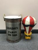 A set of two graduated lidded metal canisters together with a metal hot air balloon
