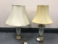 A pair of cut glass table lamps on metal bases with shades