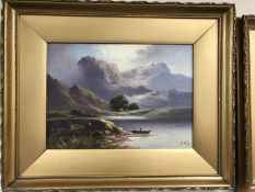 A pair of gilt framed oils on canvas paintings depicting lake scenes with mountains beyond,