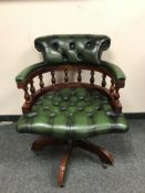 A green leather buttoned captain's chair