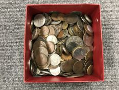 A tin containing George pennies, crowns, European coins,