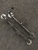 Two metal industrial coat rails