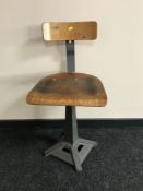 A Singer adjustable machinist's chair