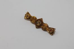 A 15ct gold diamond and ruby brooch, 3.