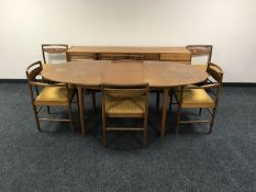 A teak McIntosh eight piece dining room suite, comprising of a low sideboard,