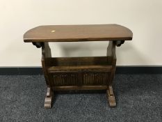 A Priory oak magazine table