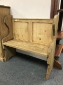 A reclaimed pine pew,